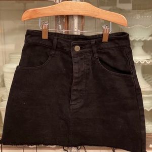 Cute black denim mini skirt.